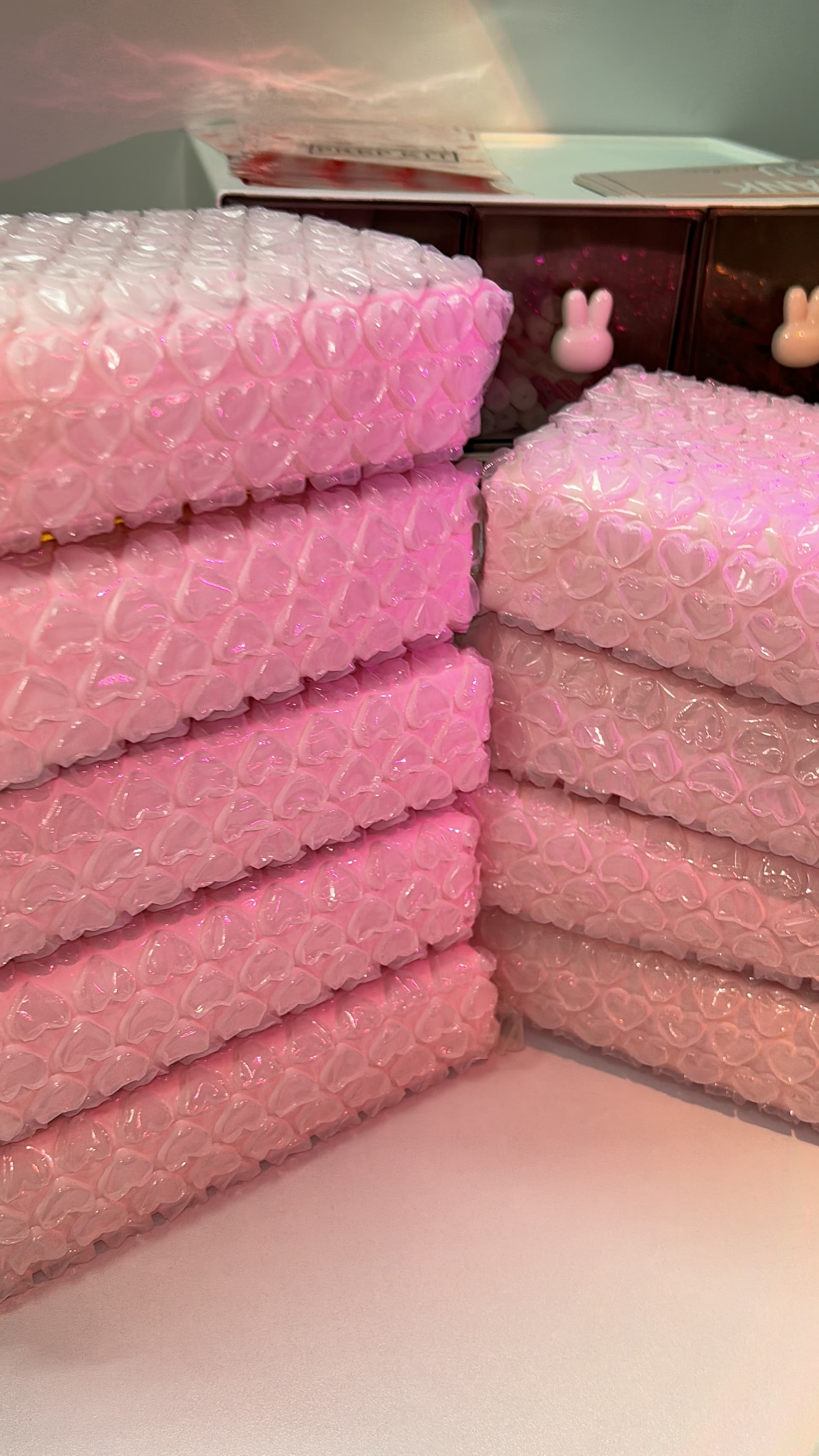 Wrapped sets stacked and ready to be posted