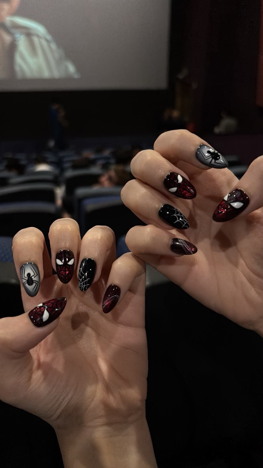 A hand-painted spider set worn on both hands