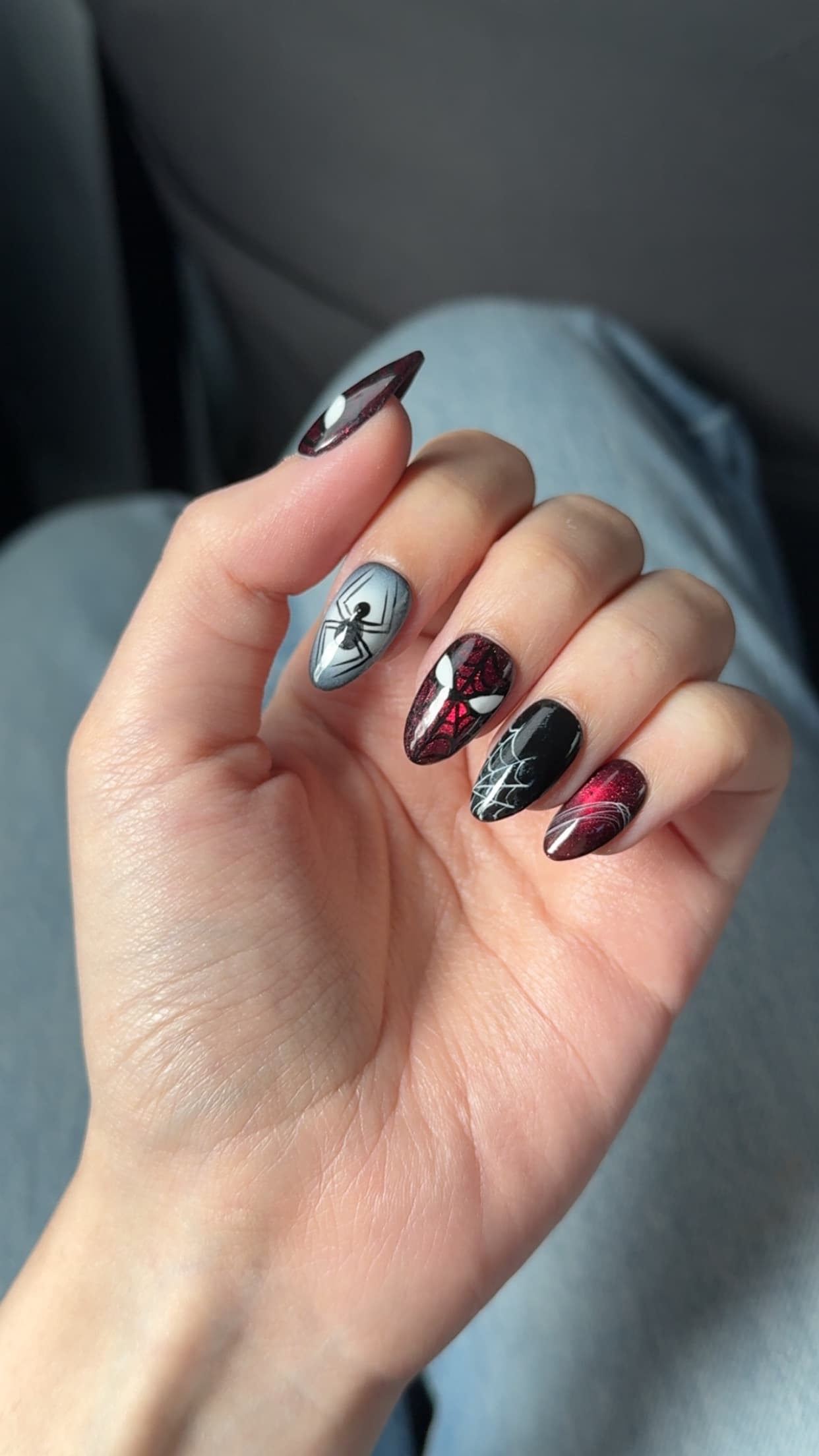 A hand-painted red and black spider set, worn