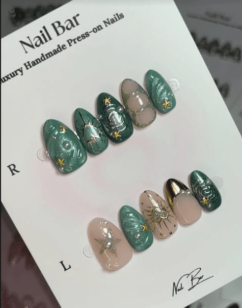 A green and gold set with pearls, on its card